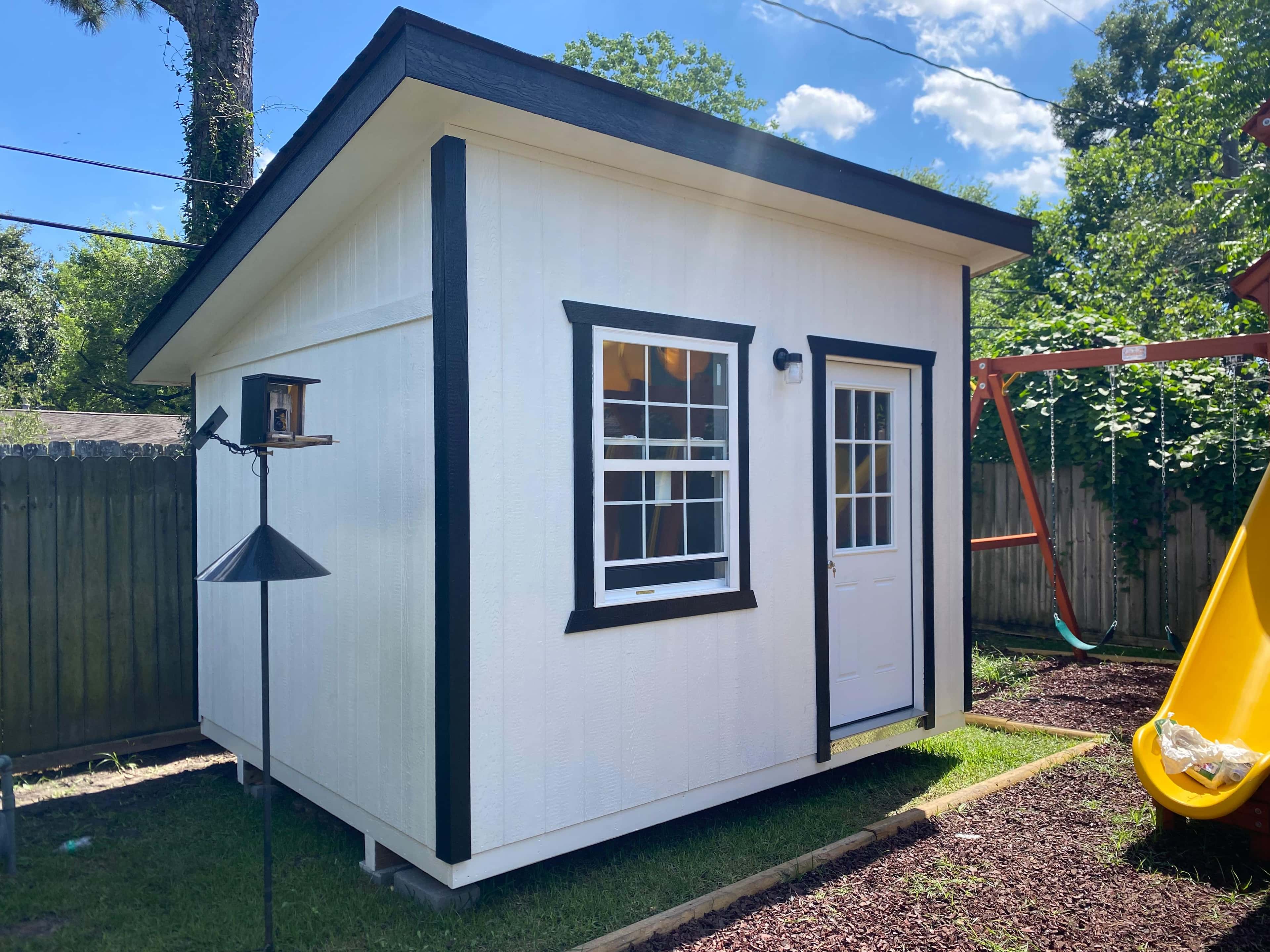 A finished Johnny's Backyard shed displayed for Houston-area shed buyers.