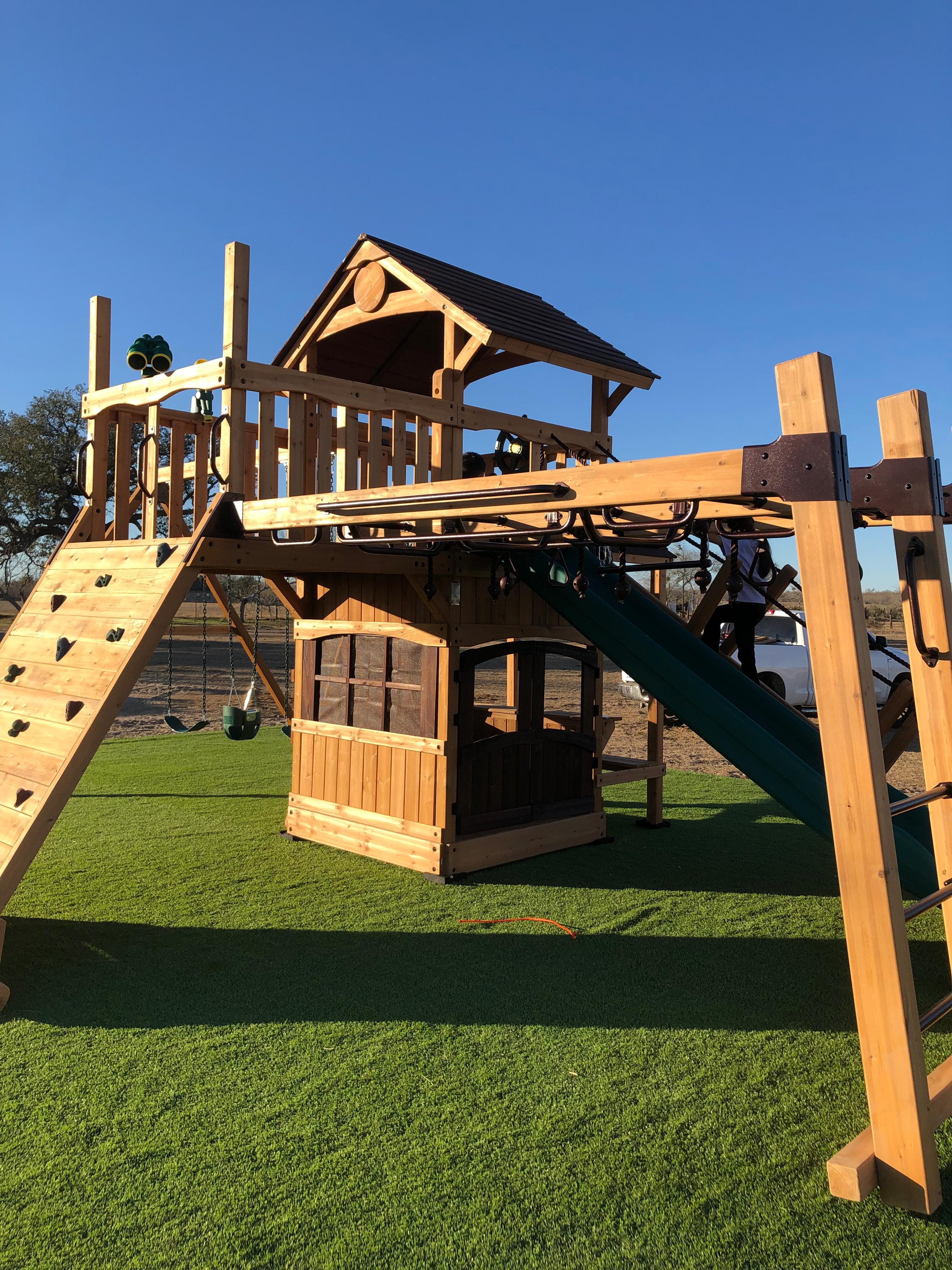 Backyard Adventures display playset with premium wood construction.
