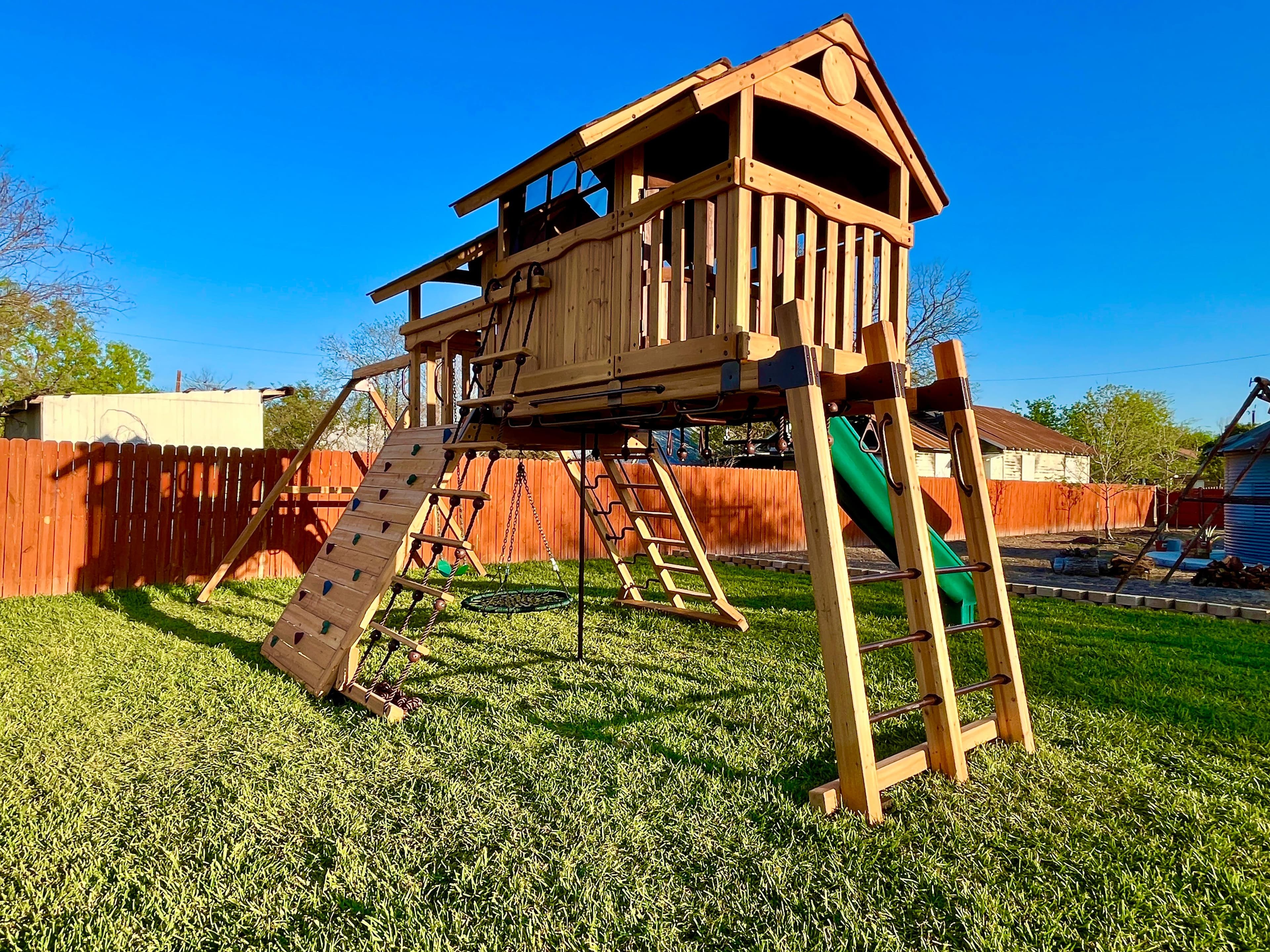 Backyard Adventures playset installation in a residential backyard.